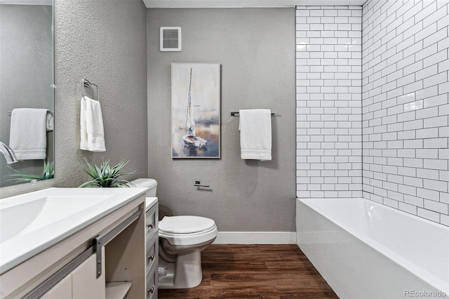 full bathroom with hardwood / wood-style flooring, vanity, toilet, and shower with separate bathtub