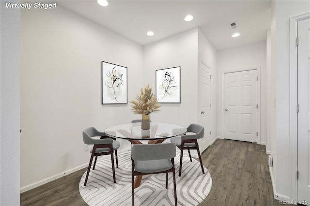 dining area featuring dark hardwood / wood-style flooring