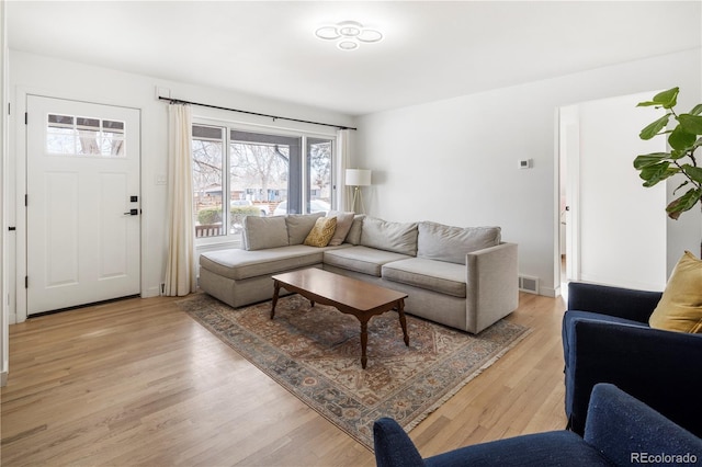 living room with light hardwood / wood-style floors