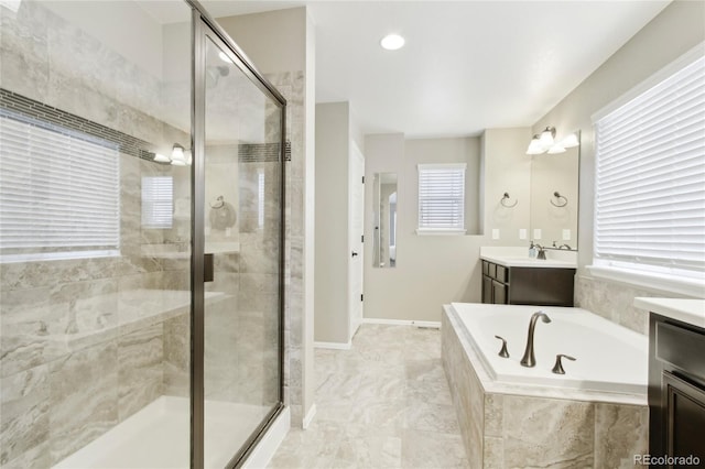 60 Stewart Way, Erie, CO 80516 - full bath with a shower stall, a garden tub, vanity, and baseboards