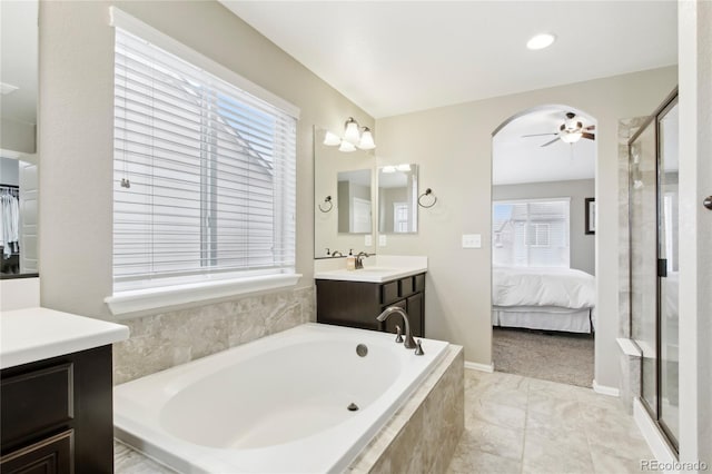 60 Stewart Way, Erie, CO 80516 - bathroom with plenty of natural light, a garden tub, a ceiling fan, and a stall shower