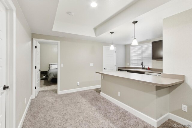 60 Stewart Way, Erie, CO 80516 - kitchen featuring a sink, light carpet, baseboards, and light countertops