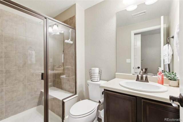 60 Stewart Way, Erie, CO 80516 - bathroom with vanity, a shower stall, and toilet