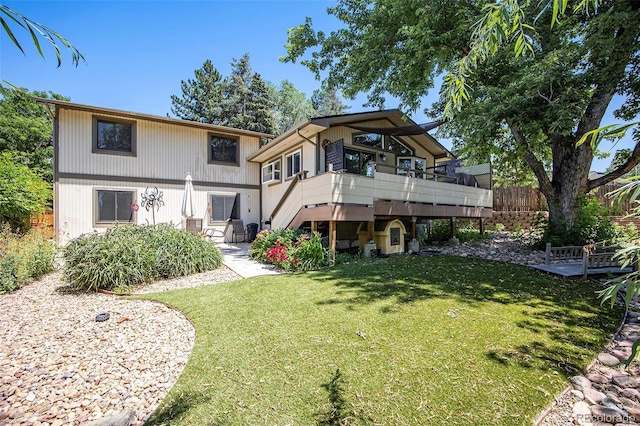 10858 E Harvard Dr, Aurora, CO 80014 - back of house with a lawn and a deck