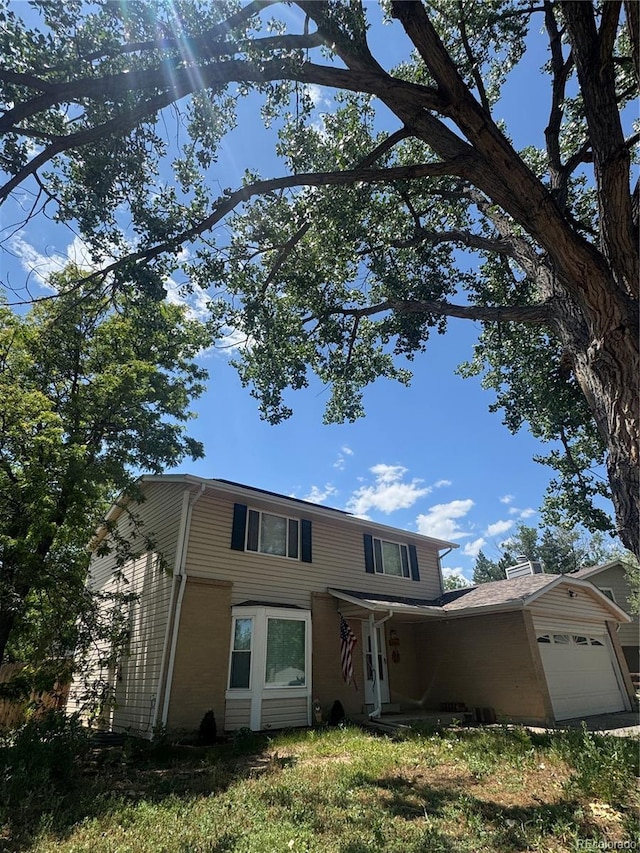 10611 Holland St, Broomfield, CO 80021 - traditional-style house featuring a garage