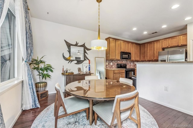 dining room with dark wood-type flooring