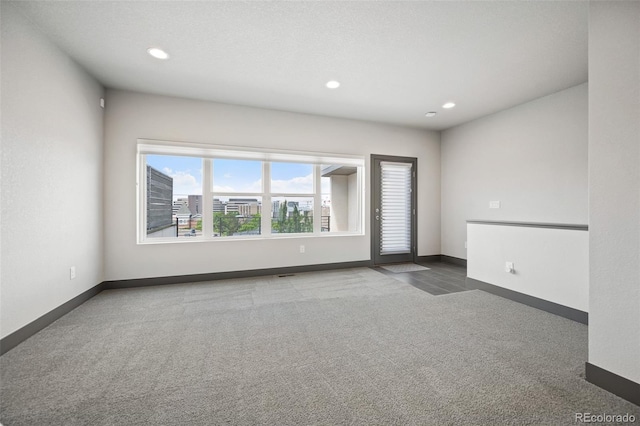 47 Harrison, Denver, CO 80206 - spare room featuring carpet flooring and recessed lighting