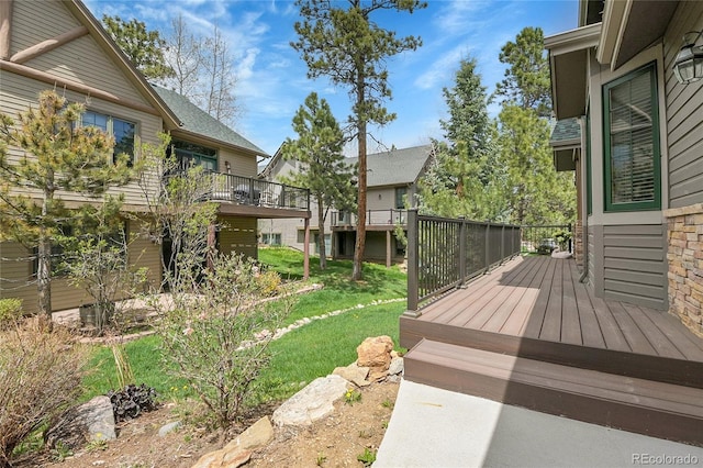 31139 Tahoe Ct, Evergreen, CO 80439 - wooden deck featuring a lawn