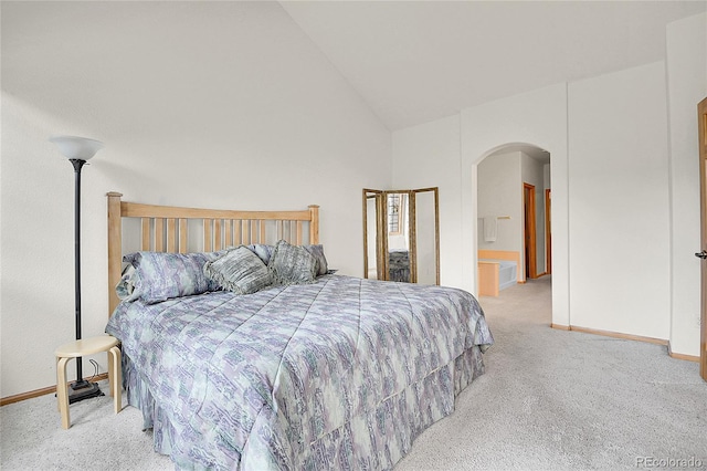 31139 Tahoe Ct, Evergreen, CO 80439 - bedroom featuring arched walkways, carpet, baseboards, and high vaulted ceiling