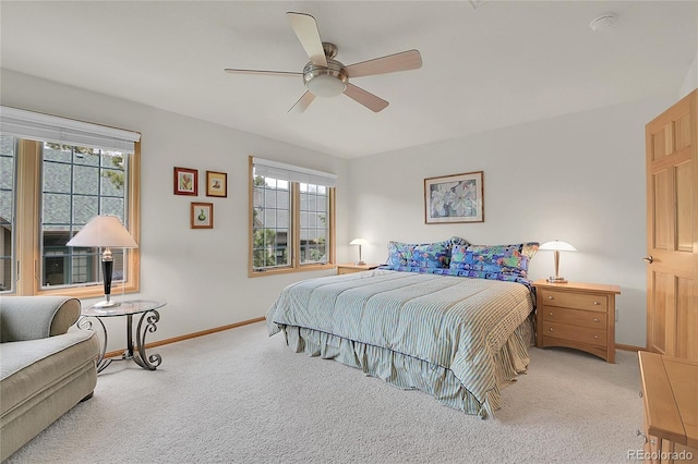 31139 Tahoe Ct, Evergreen, CO 80439 - carpeted bedroom with multiple windows, baseboards, and ceiling fan