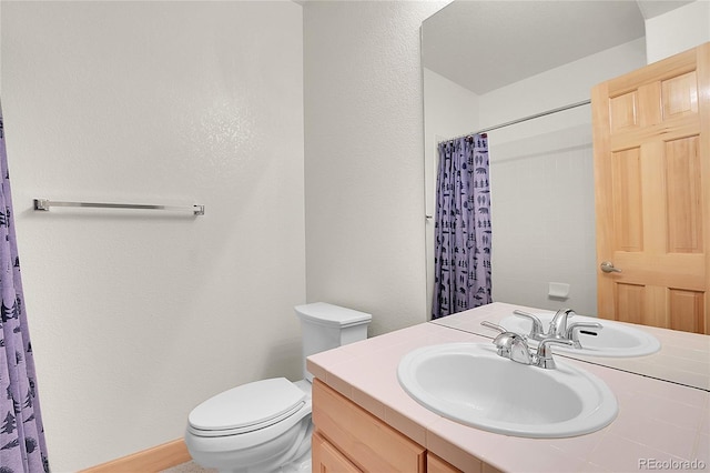31139 Tahoe Ct, Evergreen, CO 80439 - bathroom featuring vanity, toilet, a shower with shower curtain, a textured wall, and baseboards