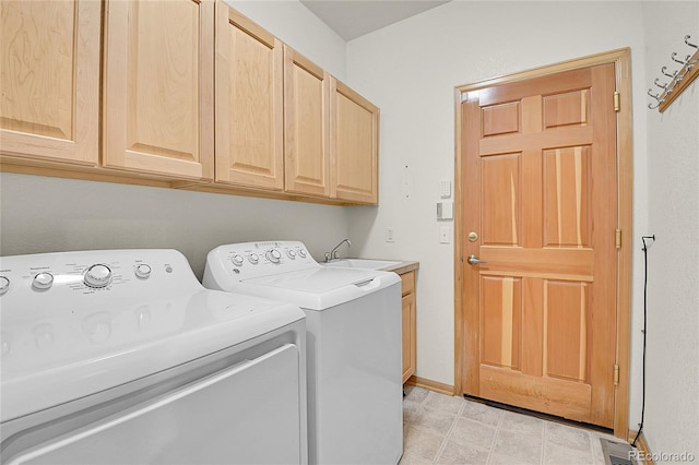 31139 Tahoe Ct, Evergreen, CO 80439 - washroom featuring separate washer and dryer, cabinet space, and baseboards