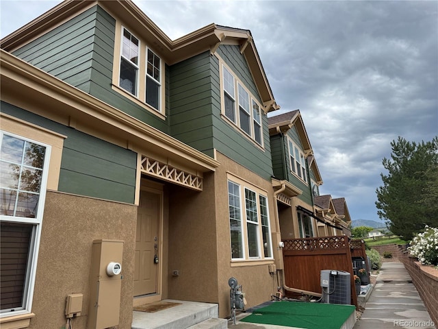 12317 W Gould Ave, Littleton, CO 80127 - view of side of property with a central AC unit and stucco siding