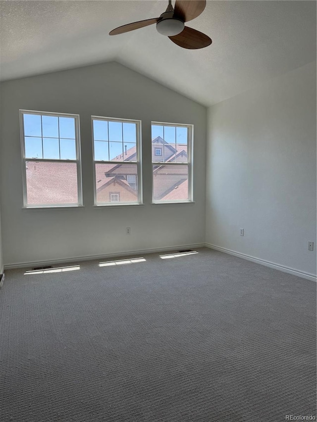 12317 W Gould Ave, Littleton, CO 80127 - spare room with ceiling fan, vaulted ceiling, and carpet