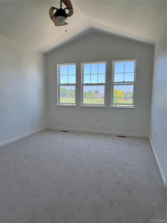 12317 W Gould Ave, Littleton, CO 80127 - carpeted spare room with ceiling fan and vaulted ceiling