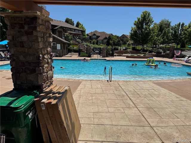 12317 W Gould Ave, Littleton, CO 80127 - community pool with a patio and a residential view
