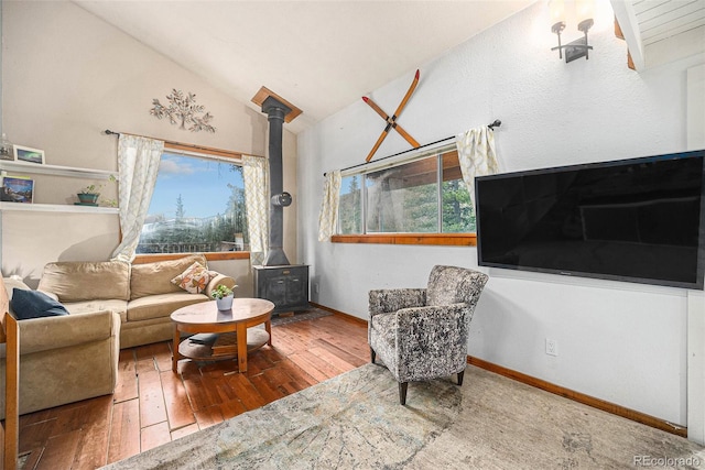 200 Crest Dr, Idaho Springs, CO 80452 - living room with a wood stove, hardwood / wood-style floors, and lofted ceiling