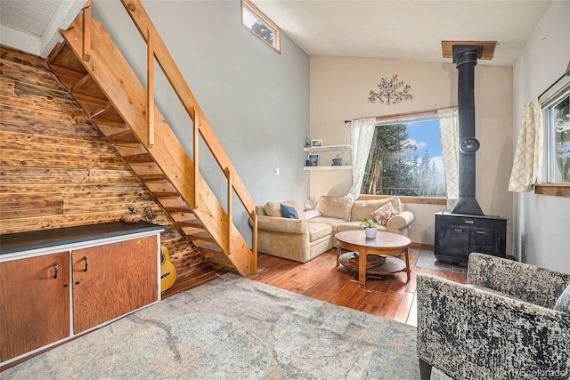 200 Crest Dr, Idaho Springs, CO 80452 - living room featuring a wood stove, hardwood / wood-style floors, stairway, and vaulted ceiling