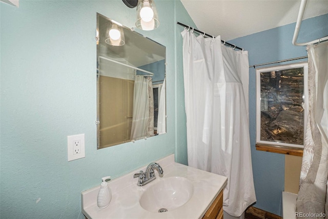 200 Crest Dr, Idaho Springs, CO 80452 - full bathroom featuring vanity, a textured wall, and curtained shower