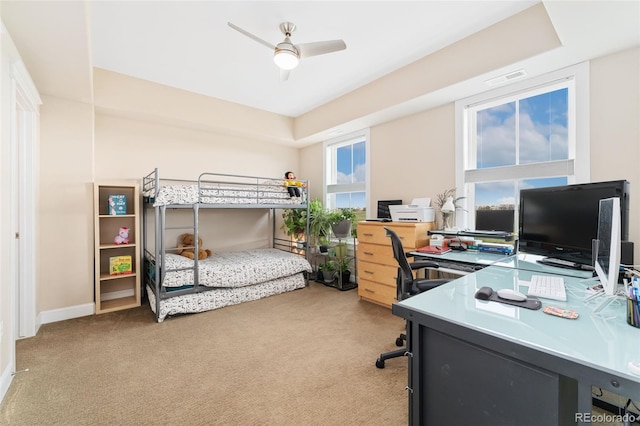 bedroom with light carpet and baseboards