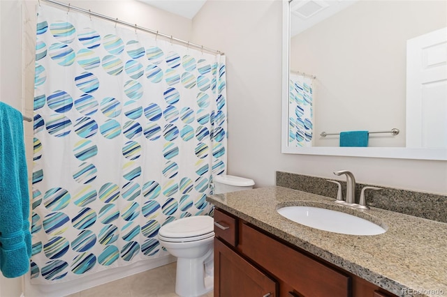 bathroom with toilet, tile patterned floors, vanity, and a shower with shower curtain