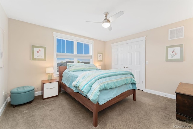 bedroom featuring carpet flooring, a closet, visible vents, and baseboards
