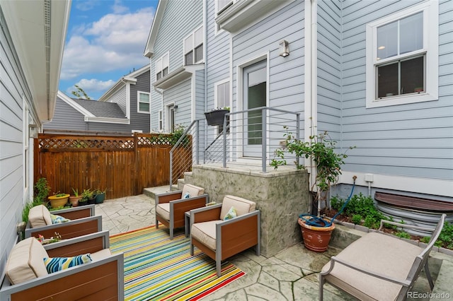view of patio / terrace featuring fence and an outdoor living space