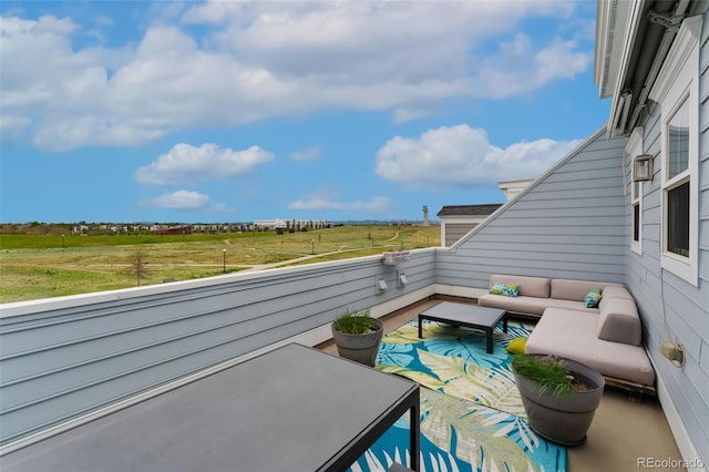 view of patio / terrace with an outdoor living space and a balcony