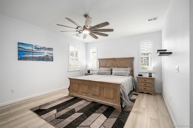9157 Rio Lado St, Littleton, CO 80125 - bedroom featuring light wood-style floors, baseboards, and a ceiling fan