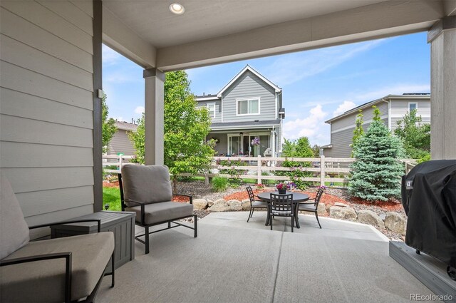 9157 Rio Lado St, Littleton, CO 80125 - view of patio / terrace with outdoor dining area and a grill