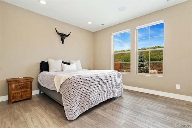 15061 W 70th Ave, Arvada, CO 80007 - bedroom with baseboards, light wood-style flooring, and recessed lighting