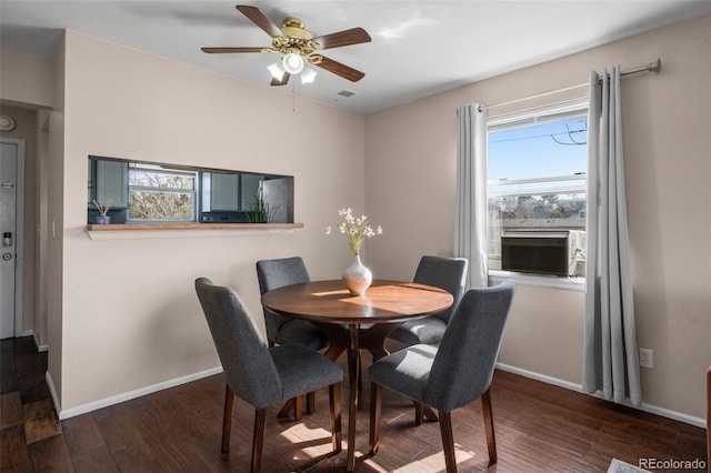 dining space featuring baseboards, a ceiling fan, wood finished floors, and visible vents