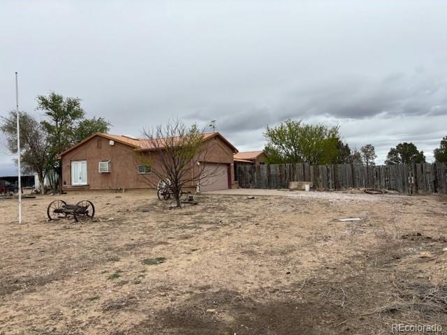 9707 County Lane 22.5, Sugar City, CO 81076 - view of yard featuring a garage