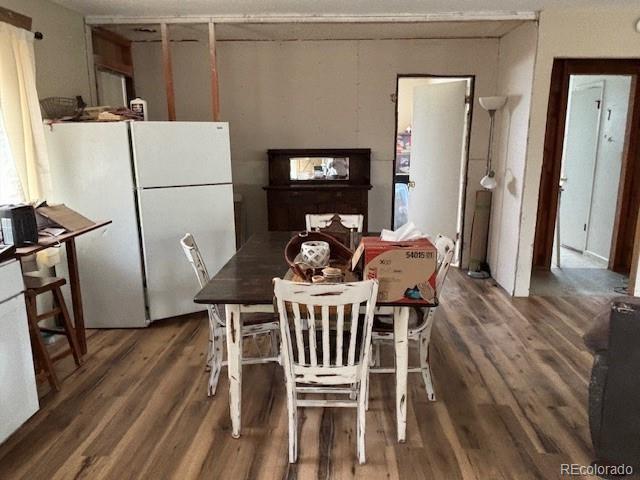 9707 County Lane 22.5, Sugar City, CO 81076 - dining space featuring wood finished floors