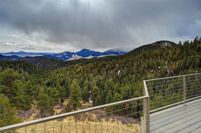 view of mountain feature with a wooded view