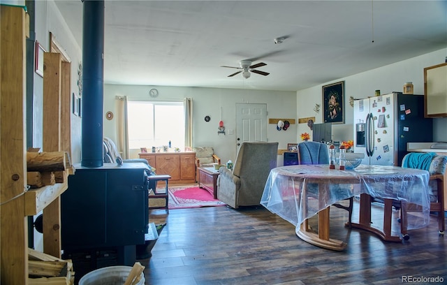 dining room with a ceiling fan and wood finished floors