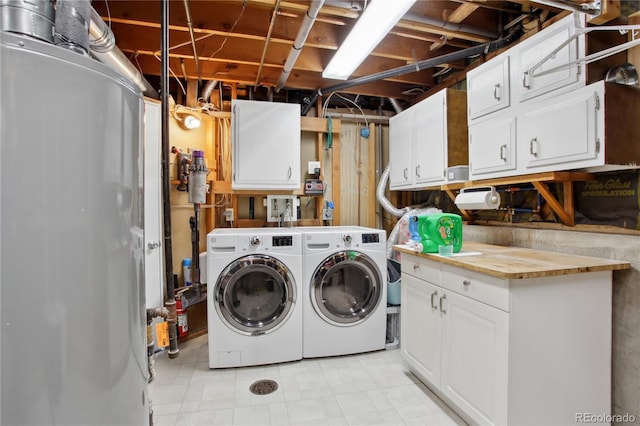12235 Garfield Pl, Thornton, CO 80241 - laundry area with washing machine and dryer, cabinet space, and water heater