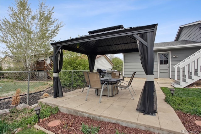 12235 Garfield Pl, Thornton, CO 80241 - view of patio / terrace with a gazebo, outdoor dining space, and stairs