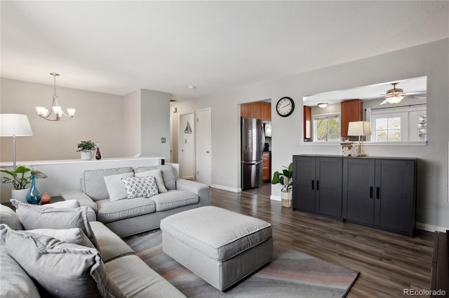12235 Garfield Pl, Thornton, CO 80241 - living area featuring dark wood finished floors, a chandelier, and ceiling fan