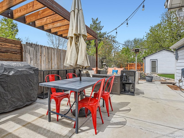 4747 S Elati St, Englewood, CO 80110 - fenced backyard with a patio, outdoor dining area, and a storage unit
