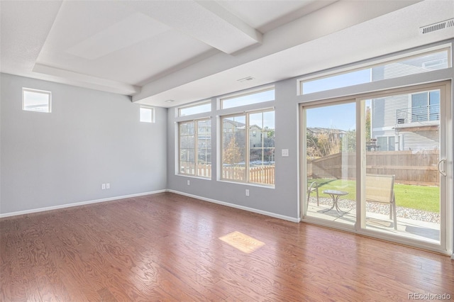 unfurnished room with hardwood / wood-style floors