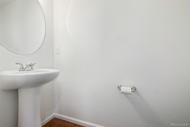 bathroom featuring sink and wood-type flooring