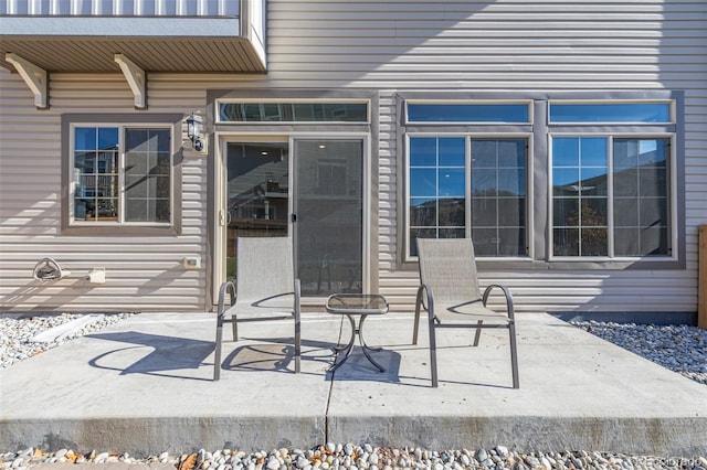 entrance to property with a patio