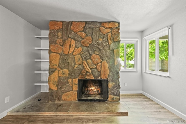 2678 S Xanadu Way Unit C, Aurora, CO 80014 - detailed view of wood finished floors and a fireplace