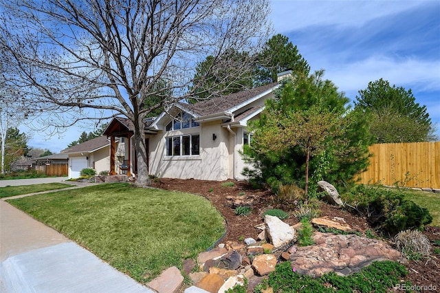 view of front of property with a garage and stucco siding