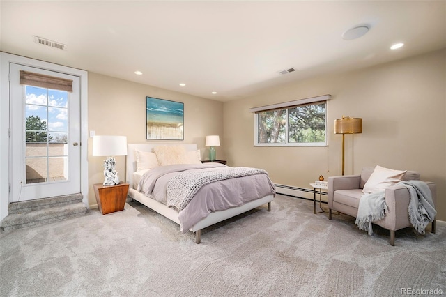 carpeted bedroom with baseboard heating, multiple windows, recessed lighting, and baseboards