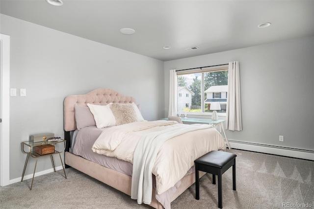 carpeted bedroom with baseboard heating, baseboards, and recessed lighting