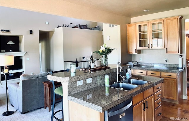 690 Antelope Dr, Bennett, CO 80102 - kitchen featuring a sink, tile counters, a center island with sink, a kitchen breakfast bar, and dishwasher