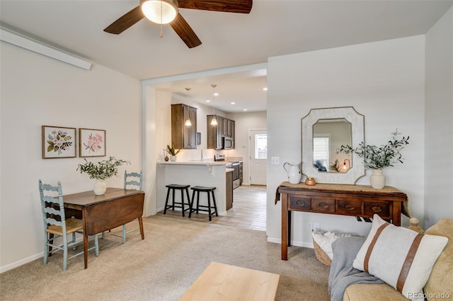 304 Barnwood Dr, Buena Vista, CO 81211 - living room featuring a ceiling fan and light colored carpet