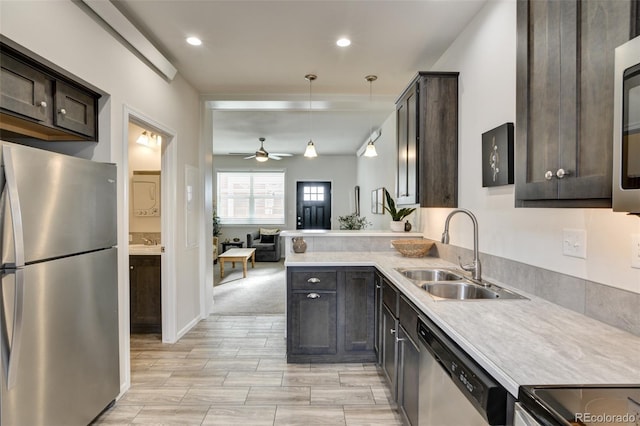 304 Barnwood Dr, Buena Vista, CO 81211 - kitchen featuring stainless steel appliances, dark brown cabinetry, a ceiling fan, light countertops, and recessed lighting